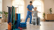 © ViskBx - A male physiotherapist assists an elderly woman exercising on a large stability ball in a bright, modern rehabilitation center.