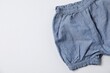 © New Africa - Baby bloomers on light grey background, top view. Space for text