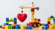 © SashaMagic - Colorful toy crane lifting heart among building blocks