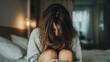 © Lemonkey - Young woman sitting on bed hugging her knees while using phone, expressing loneliness, depression, and mental health struggles in a quiet intimate moment.