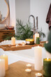 © Pixel-Shot - Stand with burning candles on bathtub in stylish bathroom