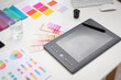 © Pixel-Shot - Interior designer's workplace with graphic tablet in office, closeup