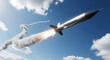 © Akoyess - A sleek, silver rocket blasts off into a clear blue sky, leaving a trail of smoke and fire.