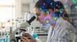 © An - A female scientist intently examines cells under a microscope in a laboratory setting. The scientist is focused and appears to be deeply engaged in her research.