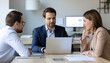 © AMH FX STOCK - Business team using an AI assistant to plan quarterly goals in an office