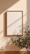 © Tyrah - Elegant framed blank canvas with natural light and minimalist decor