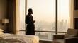 © gn8 - Circadian morning routine man in robe by sunlit hotel window