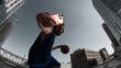 © master1305 - Athletic man taking selfie with smartphone while holding basketball in urban city. Concept of content creation, social media lifestyle, fitness influencer, digital sharing, modern active life visuals.