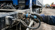 © PatrykRoams - Worker hand holding truck electrical plug portrait