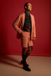 © Bliss - A stylish young man stands tall, combining colors and styles in a vibrant scene.