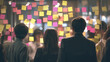 © HavingFunShop - Business team brainstorming with sticky notes on glass wal