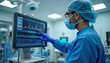 © Vadym - Surgeon in protective gear points at vital signs monitor screen in modern operating room. Medical professional analyzes patient health data on digital display during procedure.