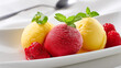 © Sabana - Scoops of colorful sorbet with fresh raspberries and mint