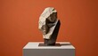 © Laras - Abstract Sculpture of a Head with a Thoughtful Expression on a Pedestal.