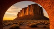 © Bali Adventure Co - Monument Valley Landscape Through Brick Arch at Sunset