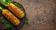 © The 2R Artificiality - Top view of grilled corn cobs with fresh parsley on rustic table with copy space