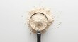 © AkuAku - Top view image of wheat flour portioned in cup for baking prep on plain white background