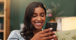 © peopleimages.com - Woman, smile and chill in apartment with phone, online dating notification and reading text message. Happy, person and relax in house with tech, mobile app and social media for digital communication.
