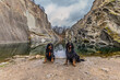 © michal - Two Hovawart dogs Canis lupus familiaris posing beside reflective quarry lake today