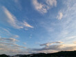 © binimin - cloud and vanilla sky background with dark mountain silhouette
