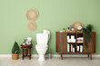 © Pixel-Shot - Stylish interior of modern restroom with potted plant