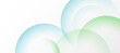 © kanpisut - Abstract white background with blue and green circle rings.