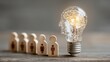 © Karaket - a lightbulb with brain human icons in wooden blocks Artificial intelligence innovation