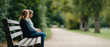 © perfectlab - Two people sitting on park bench outdoors