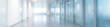 © Viktoryia - panoramic blurred empty office hallway with glass doors, clean minimalist corporate corridor interior, bright modern workspace background ideal for business, tech, healthcare and website headers