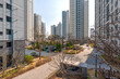© Beautiful Korea - 목련꽃과 벚꽃이 피어있는 정원이 보이는 고층아파트의 풍경, 충청북도 청주시에 위치-High-Rise Apartment Overlooking a Garden with Blooming Magnolia and Cherry Blossoms, Cheongju, Chungcheongbuk-do, South Korea
