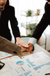 © Dino - Business handshake concept. Illustration of business people working together. Successful deal after a good meeting. Brainstorming of young modern group. Team meeting to achieve goal. Business people