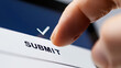 © cvetikmart - Finger hovering over digital signature field on tablet in blurred office background with submit button