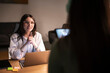 © Studio Marmellata - A doctor in a white coat consults with a patient, using a laptop and tablet to review medical information during a professional meeting.