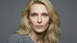 © Restyler - Portrait of a blonde woman. She exudes calm confidence and grace.
