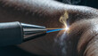 © Lightgeo - Macro shot of laser tip close to human skin blue laser beam smoke medical procedure dermatology treatment closeup technology precision healthcare
