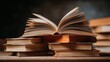 © Harry - A stack of old books with one open on top, sitting on a table in a dark room.