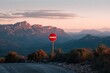 © Ольга Лукьяненко - Sunset mountain view with red no entry sign
