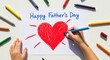 © rudesignstd - Childs Hand Drawing a Red Heart and Happy Fathers Day Message with Colorful Markers on White Paper.