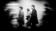 © Akbar - Motion blurred figures walk in a dark, urban scene