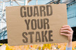 © AndriiKoval - 'Guard Your Stake' Workers who protect their stake during layoffs avoid losing unvested financial compensation. STAKE. PROTECT. WORKERS. UNVESTED. COMPENSATION.