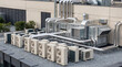 © Yudi - Modern rooftop HVAC system with multiple air conditioning units and extensive ventilation ducts on a commercial building