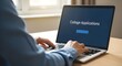 © Creative_House_67 - Person typing on laptop with college application on screen, application process