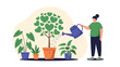 © MD - Caring woman uses a blue watering can to nurture a heart shaped tree and various other green potted plants to promote a love for gardening and nature.
