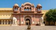 © SAYEDA - Majestic palace entrance with intricate jharokhas and clear blue sky background