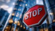 © EndlessVFX - Close-up of stop sign in front of blurred cityscape with modern buildings