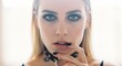 © W.O.W - Portrait of beautiful caucasian woman with black makeup and choker looking at camera. Fashion model with smokey eye makeup. Concept of feminine beauty, style, rock mood and youth culture.