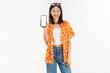 © sitthiphong - Portrait of young Asian woman in summer wearing floral shirt holding smartphone mockup of blank screen and smiling on white background