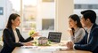 © Kadek - Real Estate Agent Explaining House Model to Couple in Office