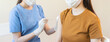 © Pormezz - People getting a vaccination to prevent pandemic concept. Woman in medical face mask  receiving a dose of immunization coronavirus vaccine from a nurse at the medical center hospital