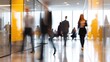 © juwairiya_nameera - Business people walking through modern office hallway with yellow accents